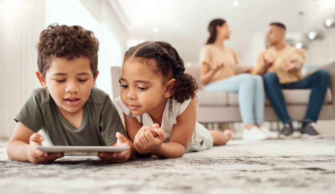 Children lying together on clean carpet