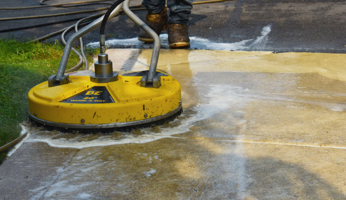 Professional concrete cleaning with equipment