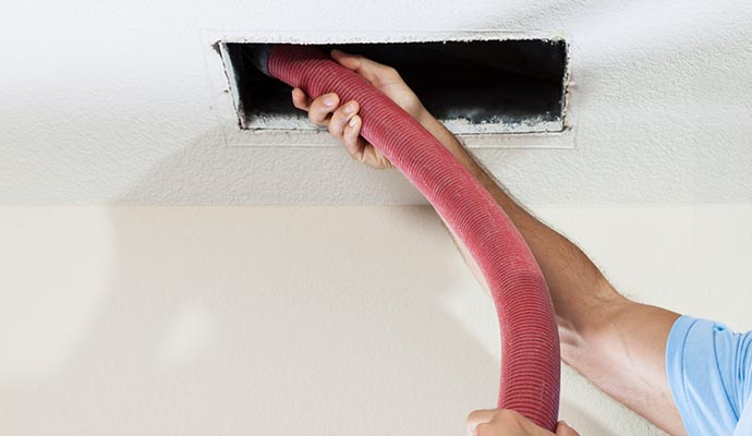 Air duct cleaning with vacuum