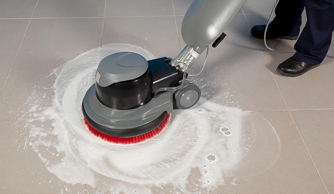 Tile floor cleaning with an equipment